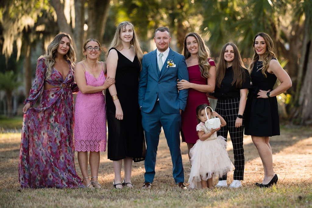 The happy couple surrounded by their loved ones on their special day.jpg