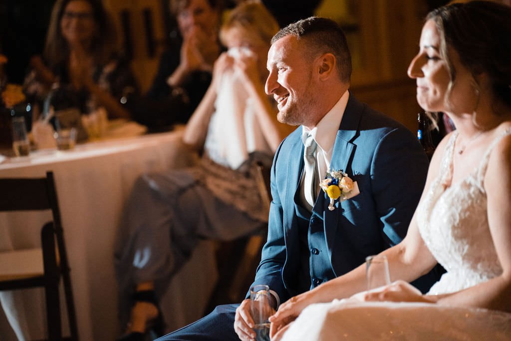 The newlyweds share a smile and a moment during their reception.jpg
