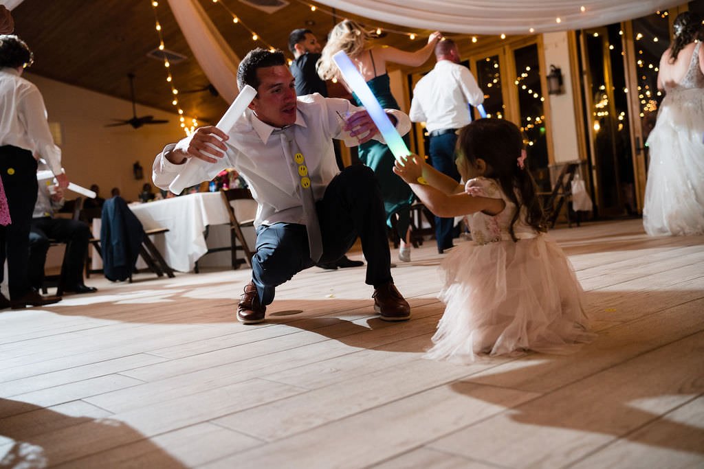 Wedding reception fun This little one is having a blast with the glow sticks.jpg