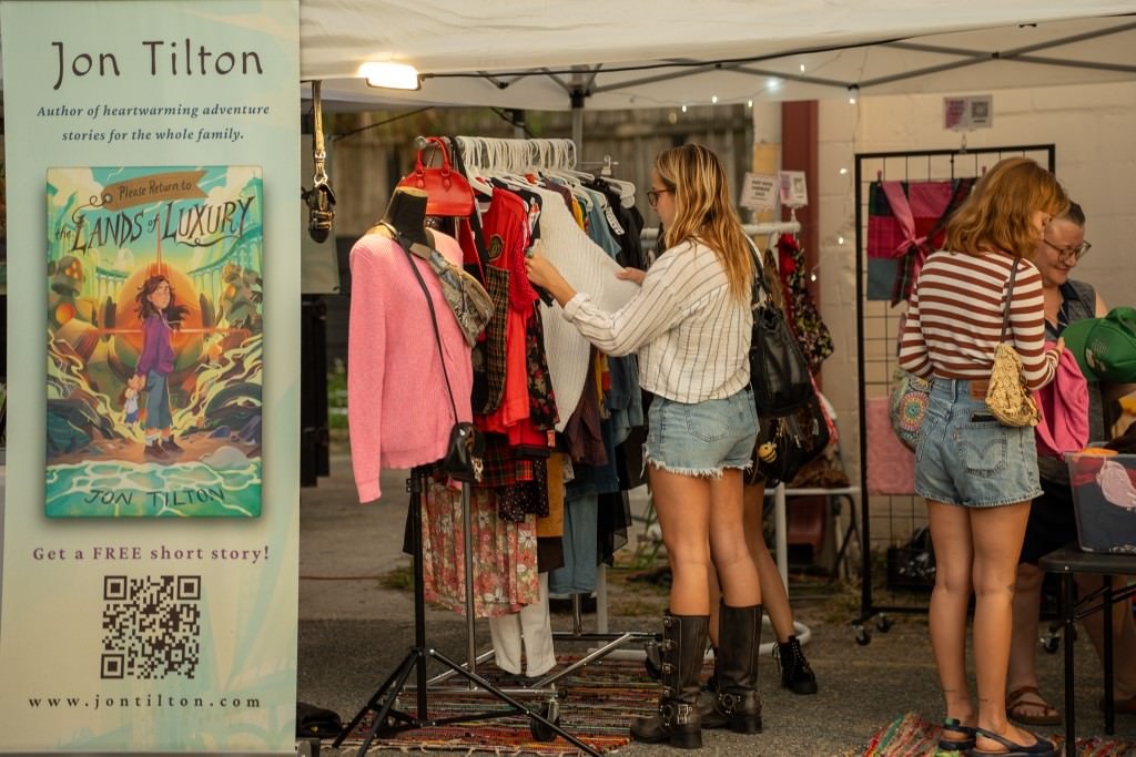 Browsing clothes at outdoor market.jpg