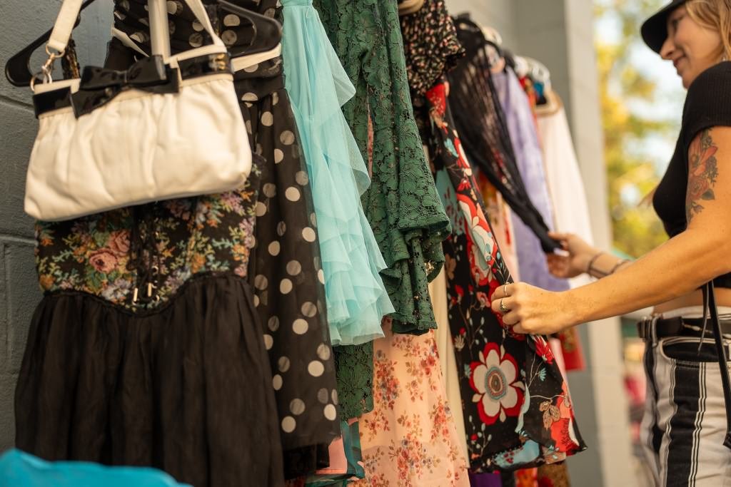 Browsing colorful dresses outside shop.jpg