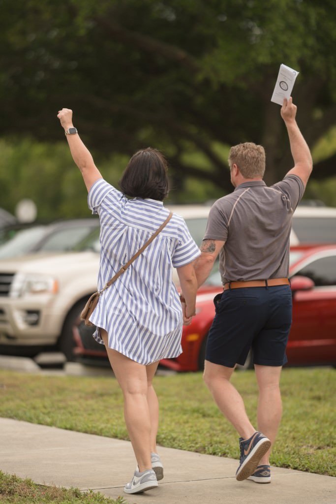 Cheerful walk with raised arms.jpg