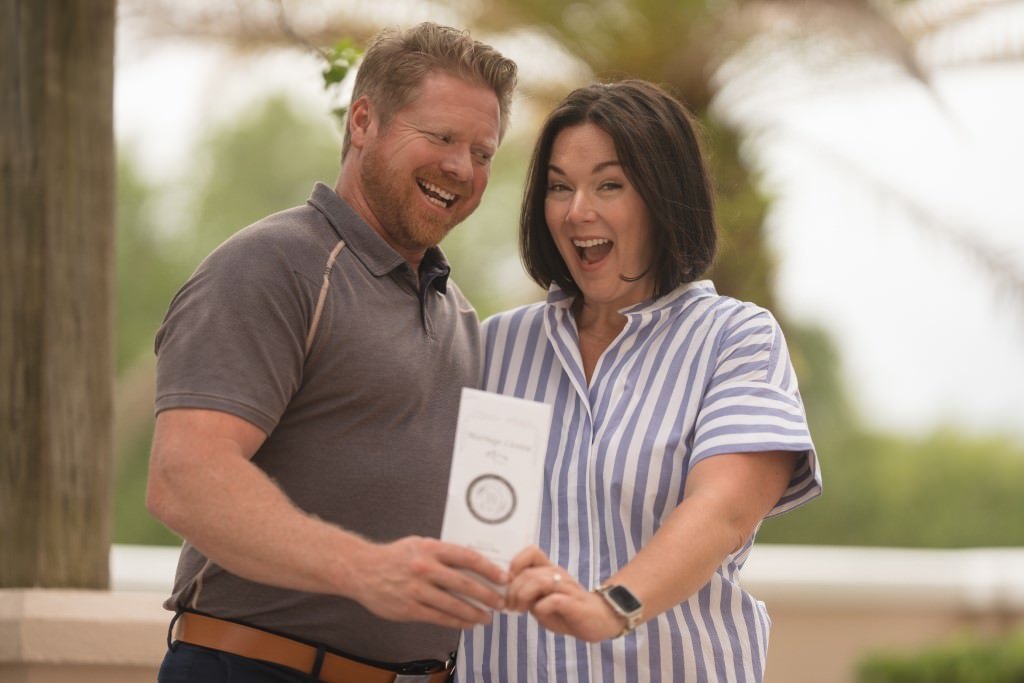 Couple joyfully celebrates winning prize.jpg