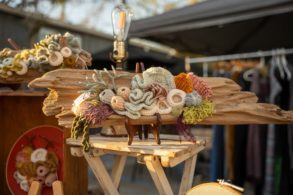 Crochet art on wooden display.jpg