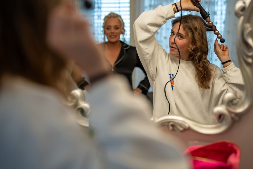 Curling hair with friend nearby.jpg
