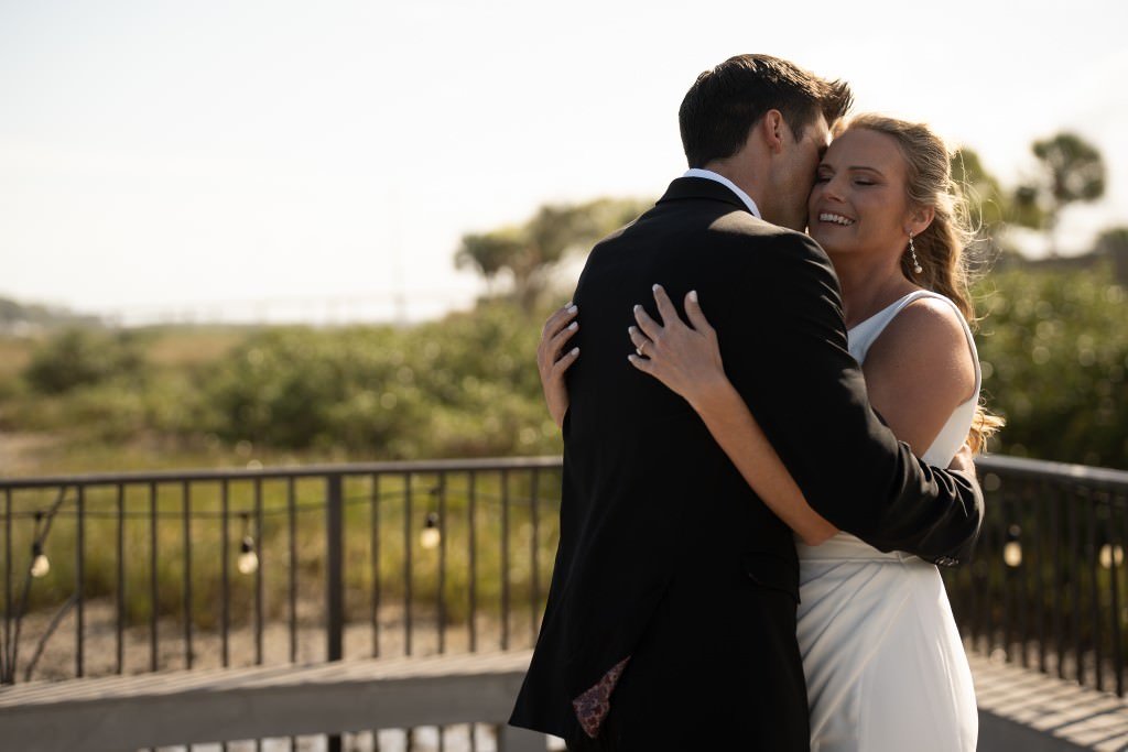 Joyful embrace at outdoor wedding.jpg