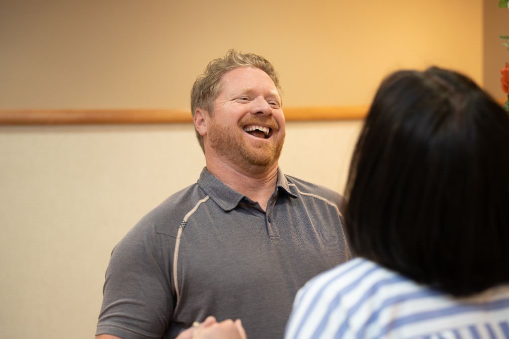 Man laughing with a bride.jpg