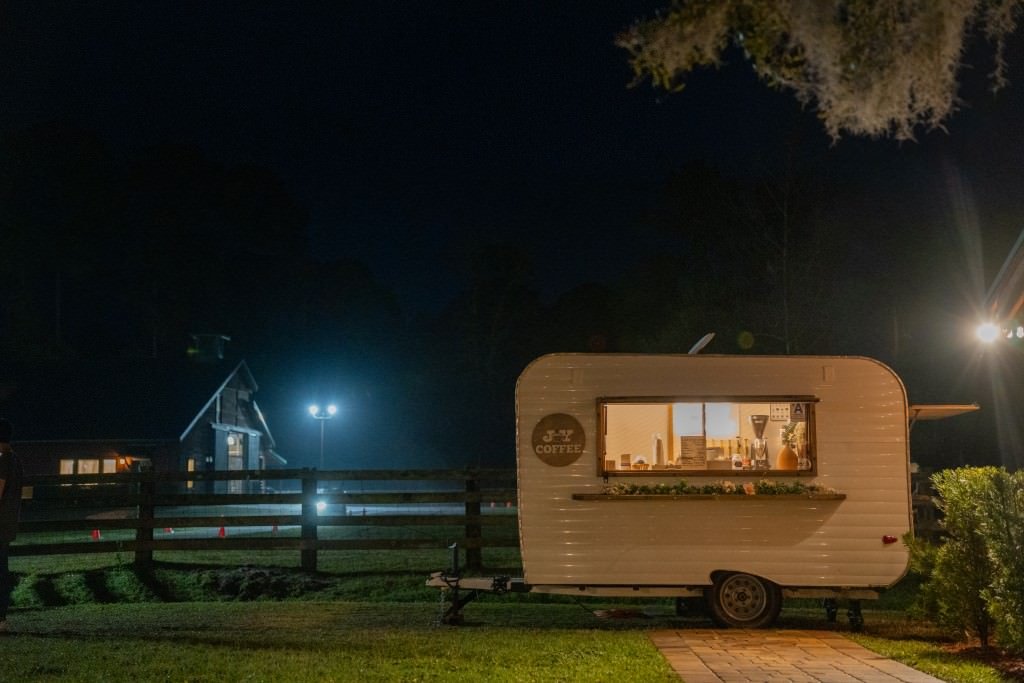 Nighttime coffee stand illuminates surroundings.jpg