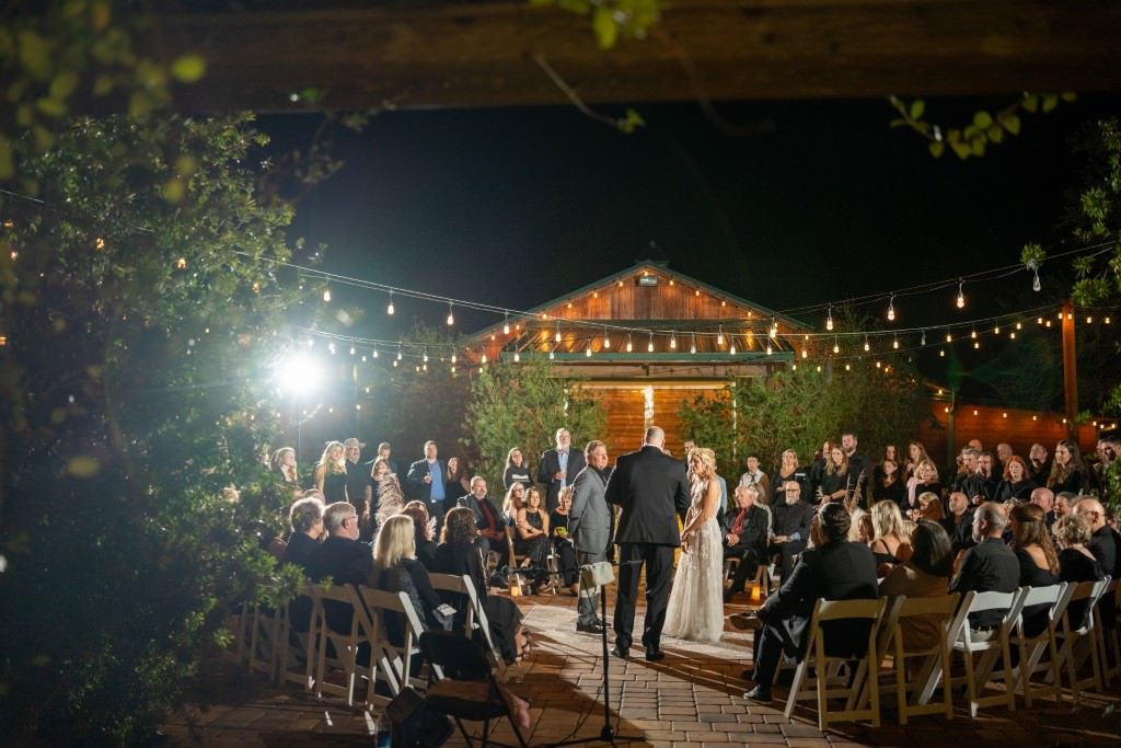 Outdoor evening wedding ceremony scene.jpg