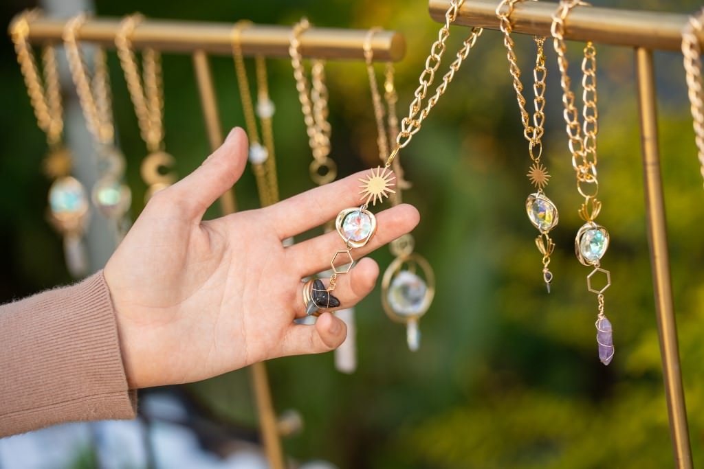 Selecting intricate golden necklaces.jpg