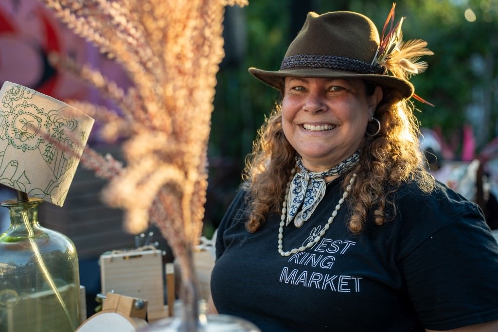 Smiling vendor at market stall.jpg