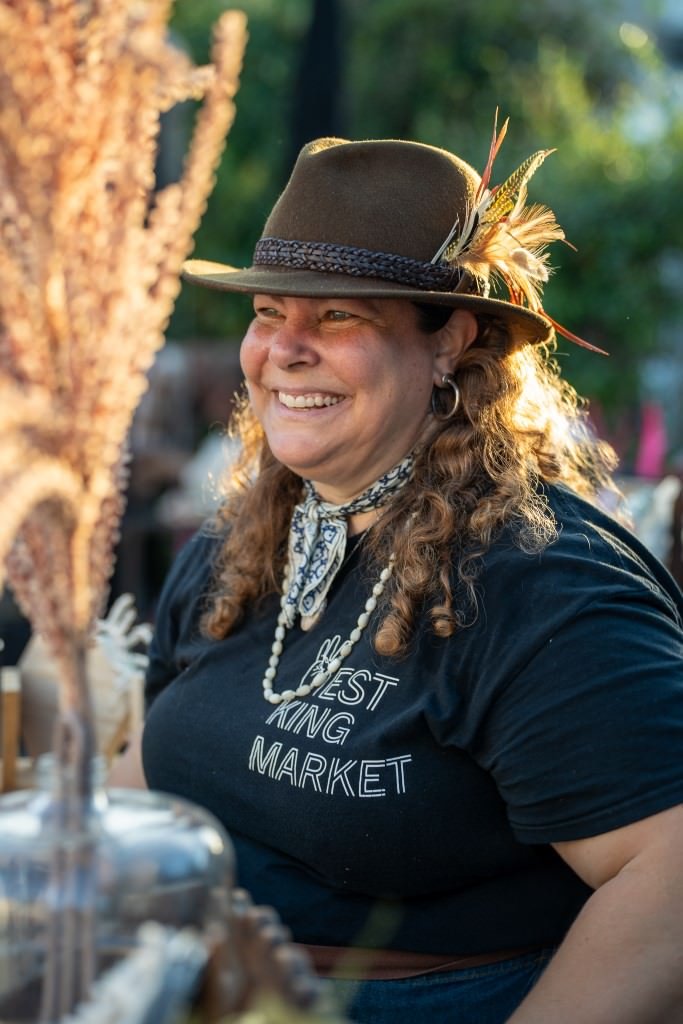 Smiling woman at outdoor market.jpg