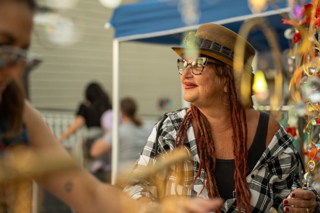 Woman selling crafts outdoors.jpg
