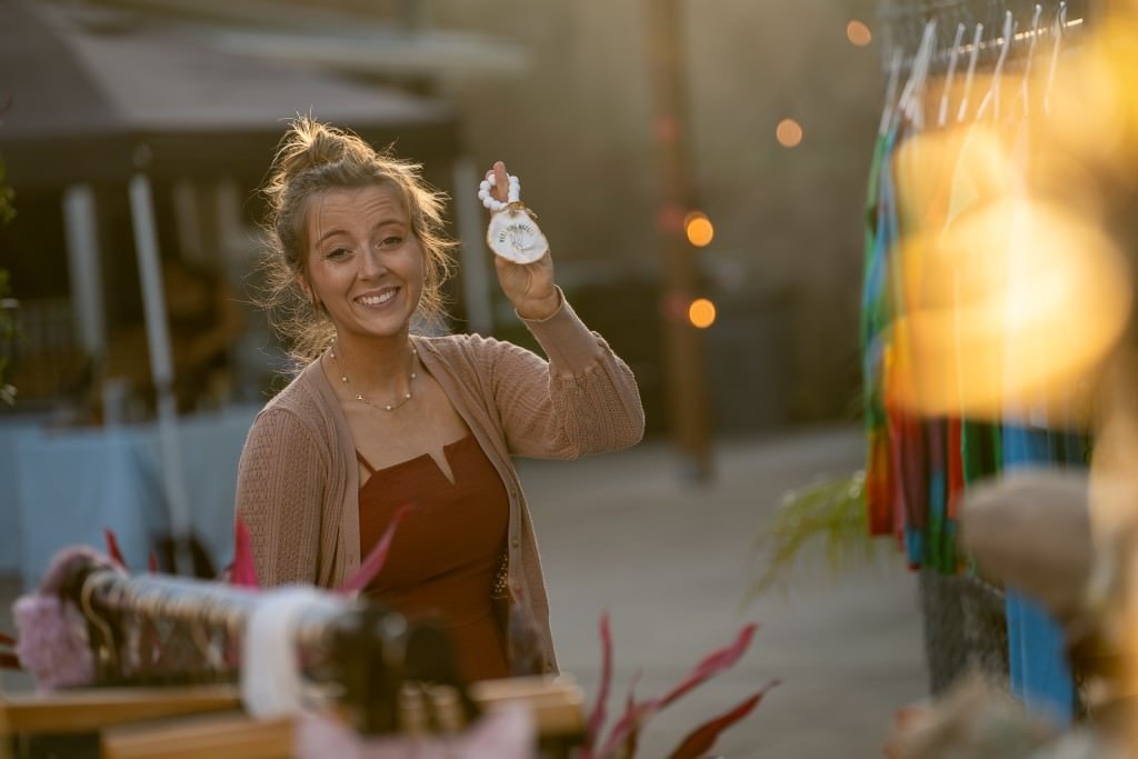 Woman smiling holding an ornament.jpg
