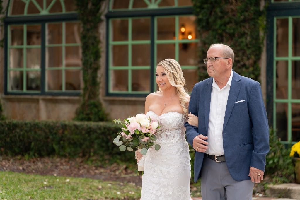 Bride and father walking together.jpg