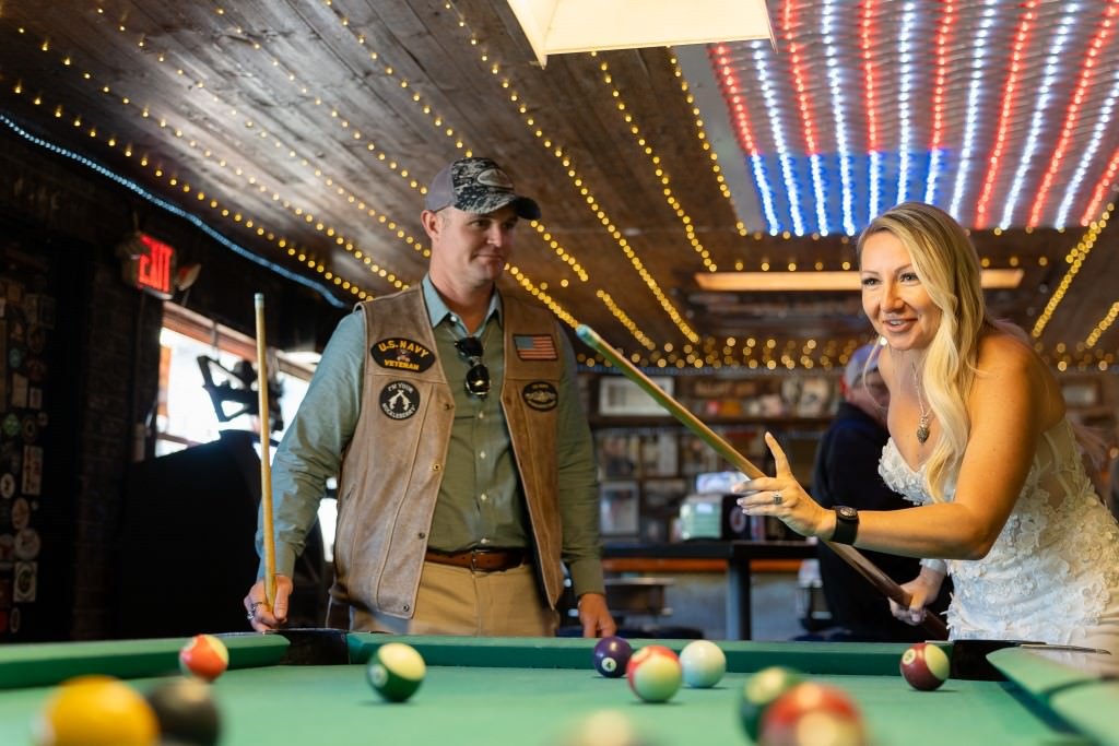 Playing pool together smiling.jpg