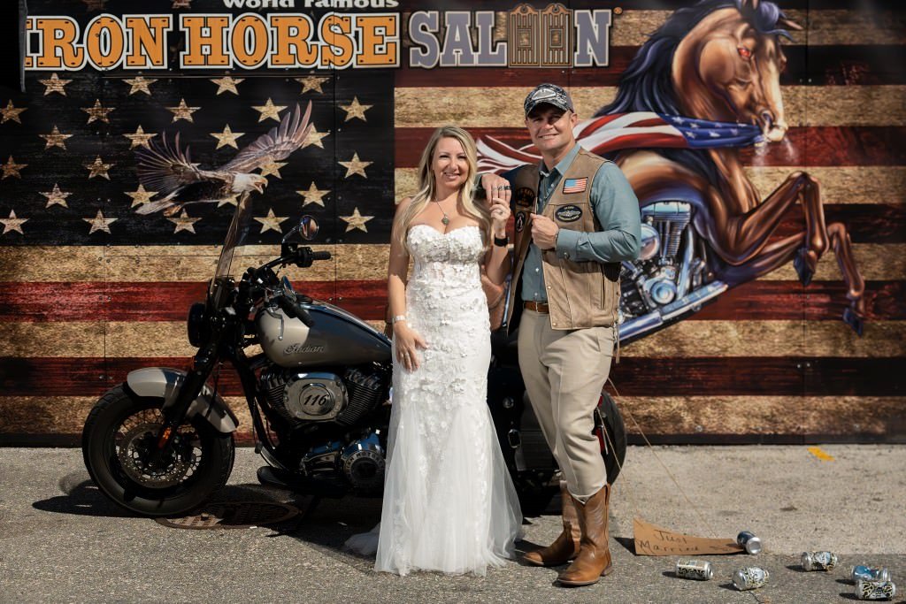 Wedding celebration with motorcycle backdrop.jpg